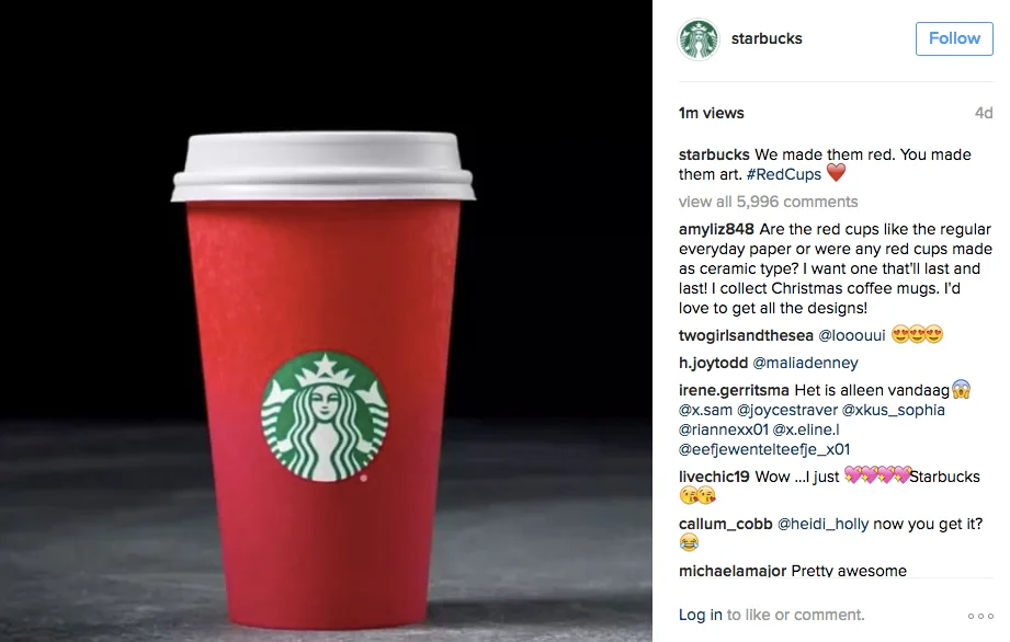 Red Starbucks cup with white lid on dark background. Green logo visible. Text mentions "Red Cups" with heart emoji and multiple comments.